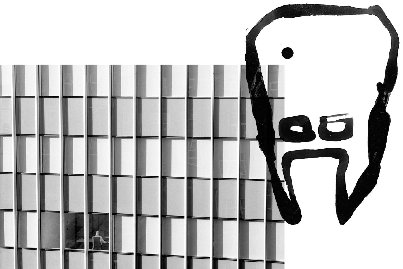 Image of modern office building totally empty except for one person