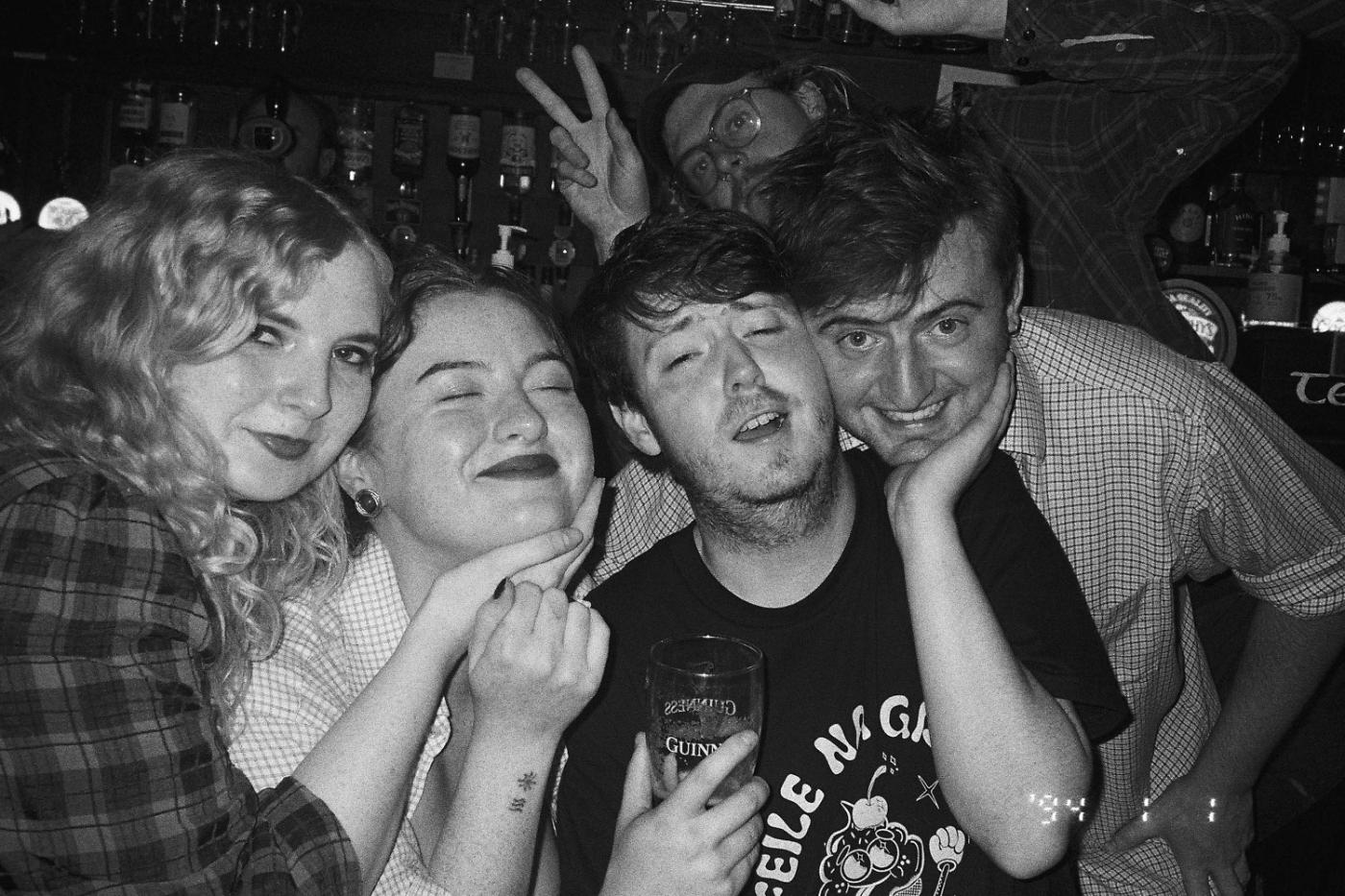 Five friends smiling