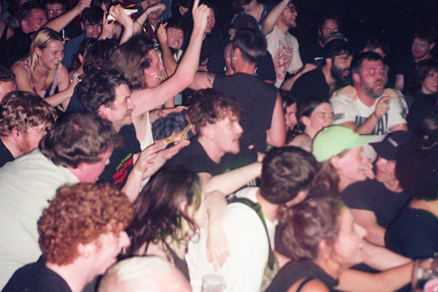 Photo of a lively dancing crowd at a busy gig