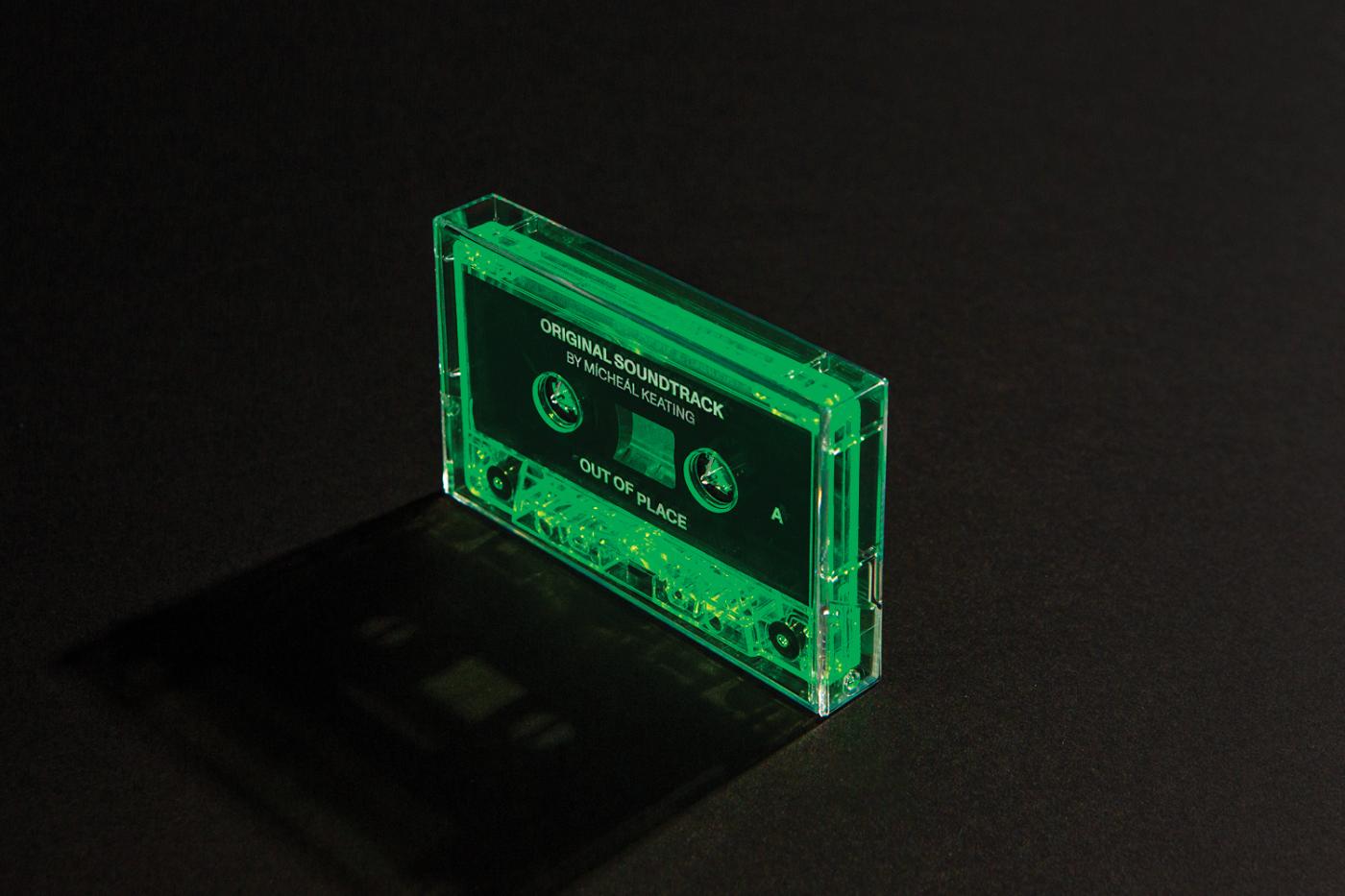Fluorescent green cassette on a black table